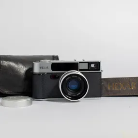 Konica Hexar Silver with 35mm f2 lens, leather case, and strap