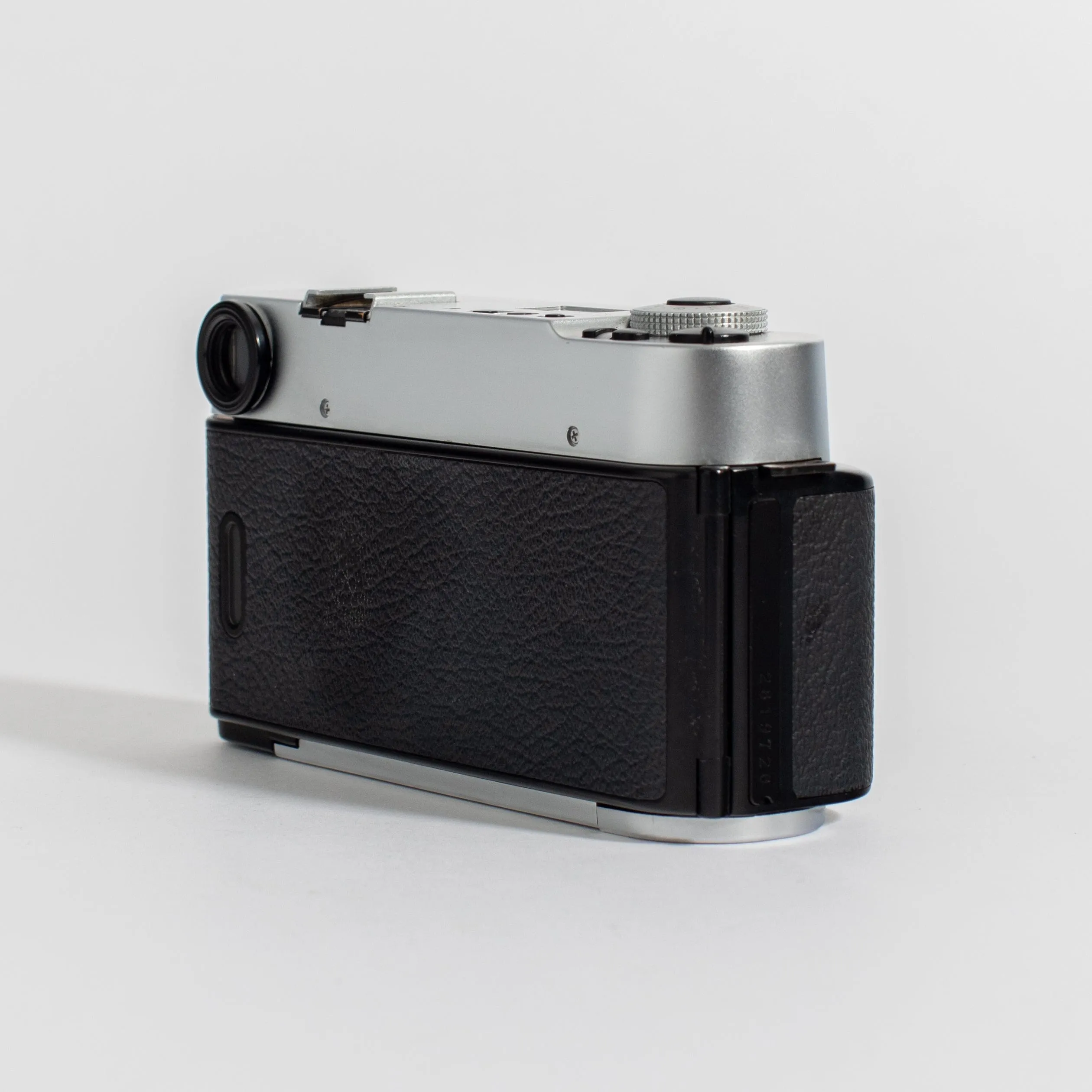 Konica Hexar Silver with 35mm f2 lens, leather case, and strap