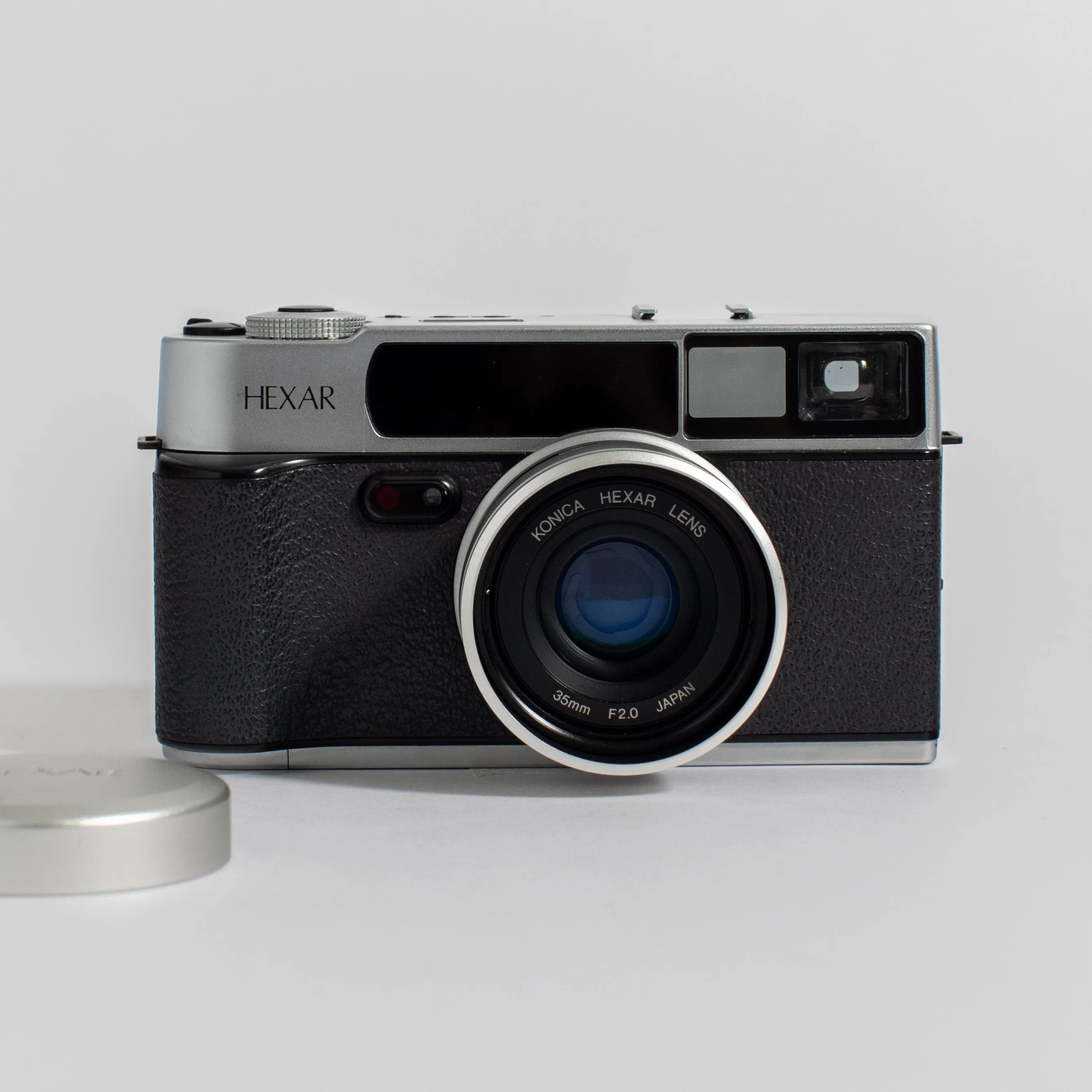 Konica Hexar Silver with 35mm f2 lens, leather case, and strap